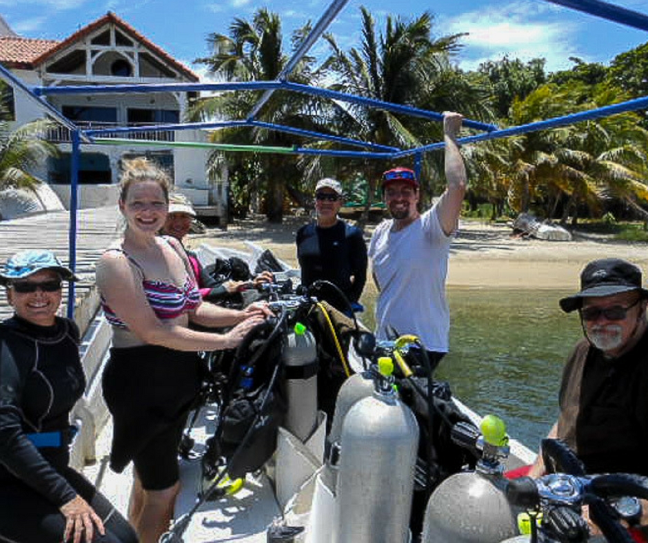 Roatan One of the Bay Islands in the Caribbean, Honduras - 1AdventureTraveler | Journey with me to this lush green island with white sand and beautiful fish in the crystal clear water. | caribbean | scuba diving | snorkeling | travel | scuba | beach | ocean | 